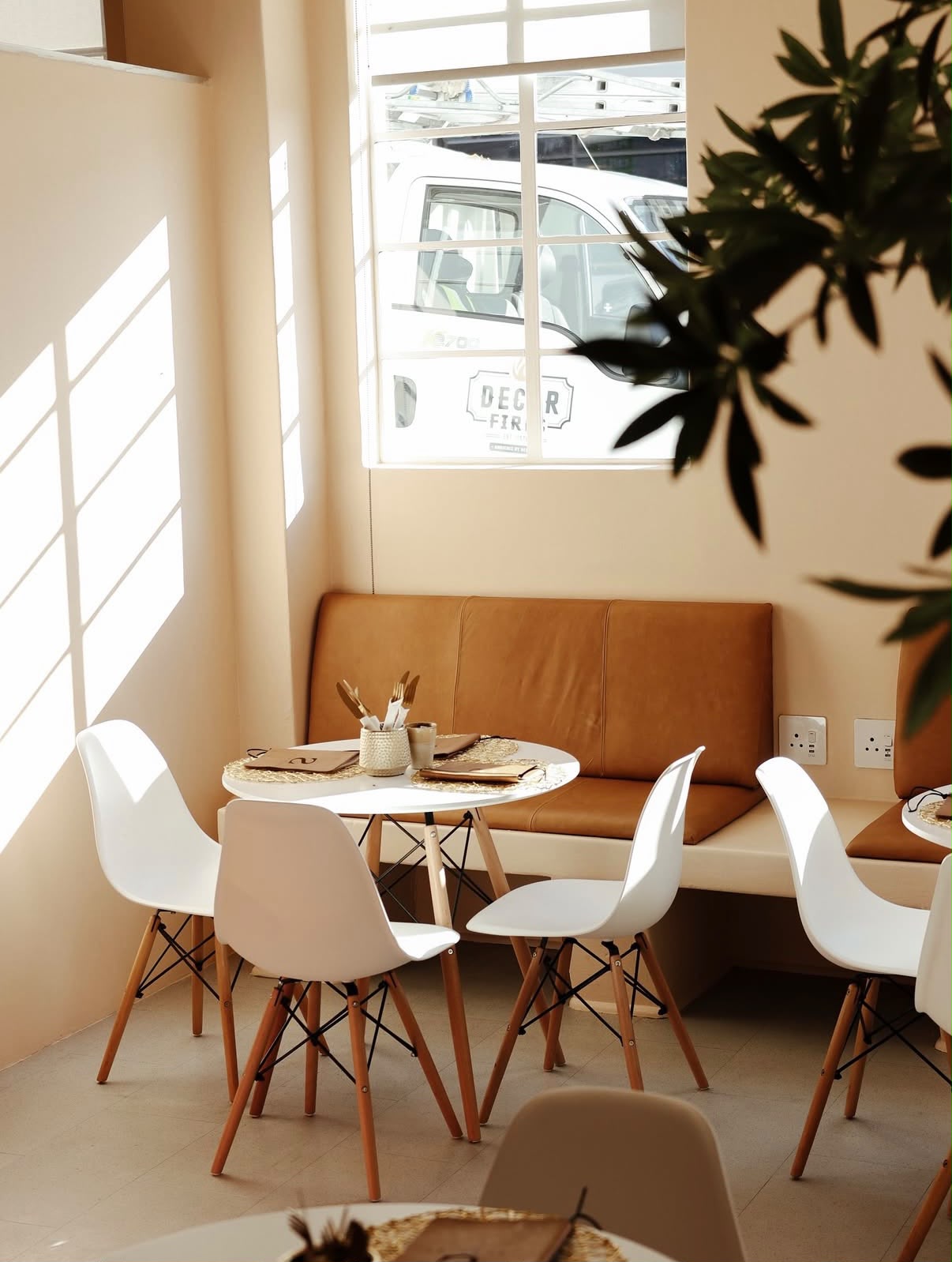 Sunlit banquette seating at FIVE